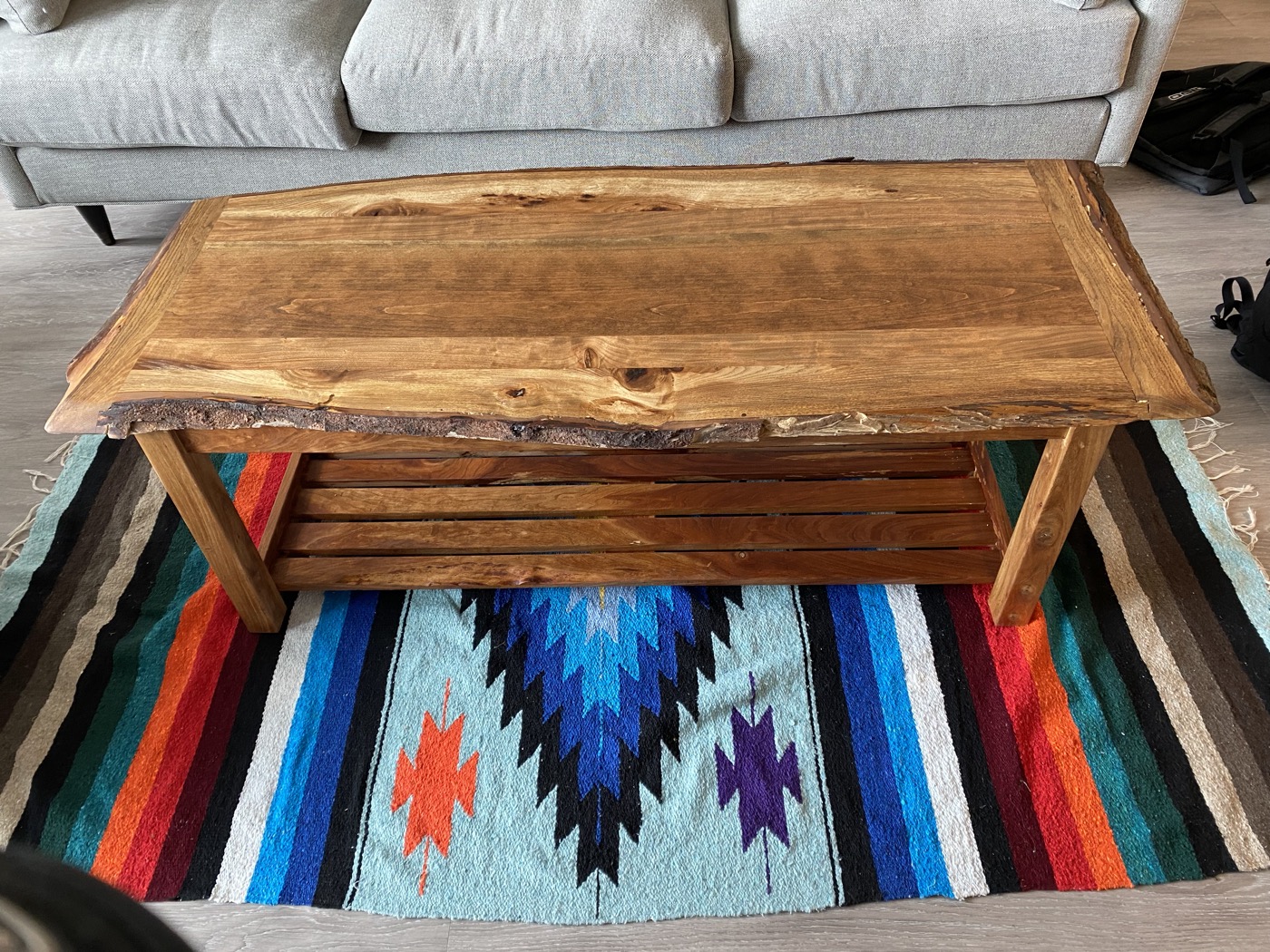 Top view of live-edge walnut coffee table showing natural bark edge detail